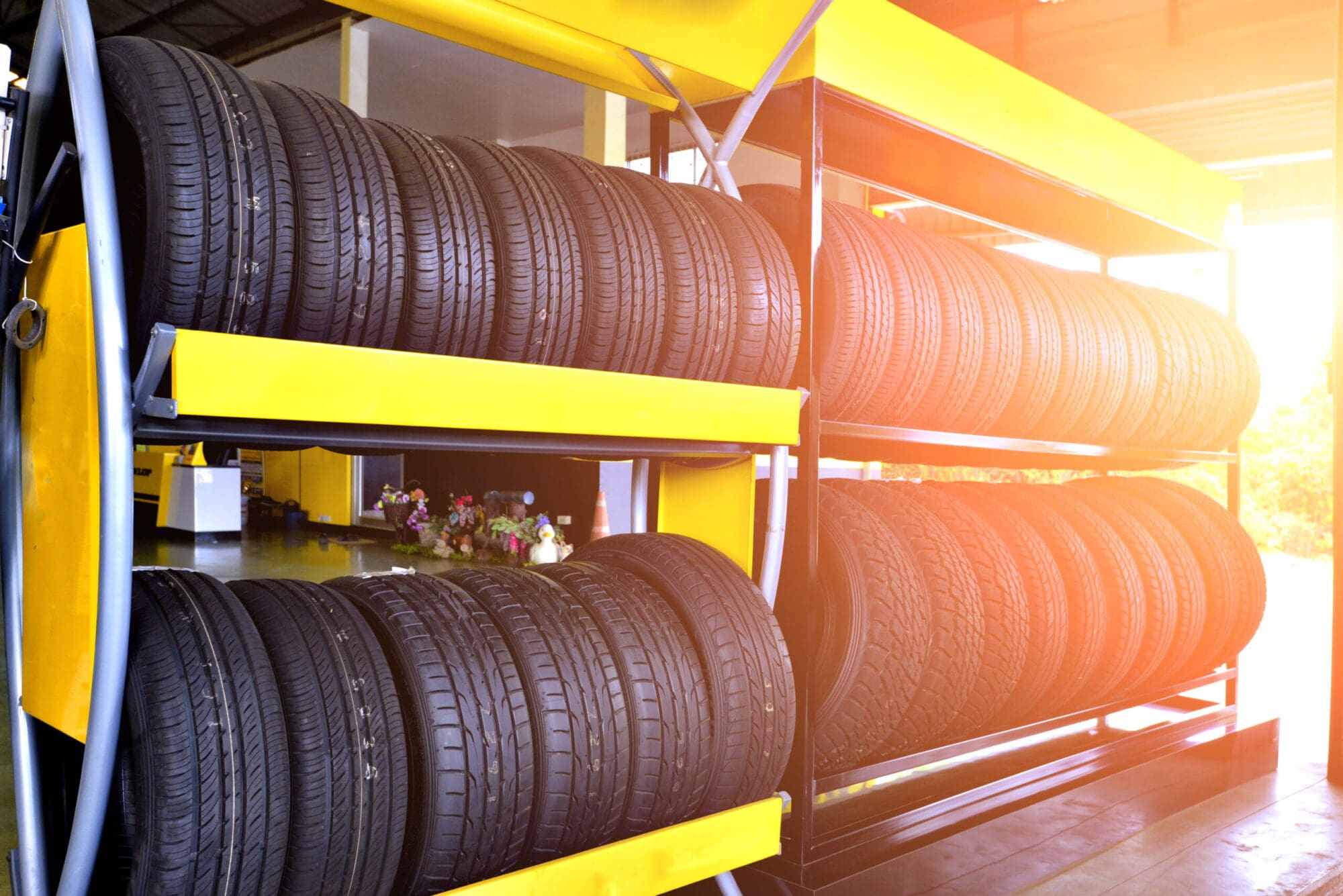 Rows of new tires displayed on shop racks