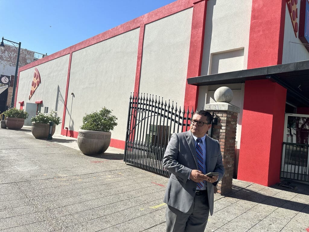 Joe near the pizza building